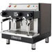 A black and silver Astra Mega II Compact semi-automatic espresso machine with two coffee cups on top.