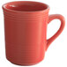 A close-up of a Tuxton Cinnebar red coffee mug with a handle.