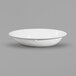 An Elite Global Solutions white oval melamine bowl with a white rim.