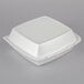 A Dart white foam square take out container with a lid.