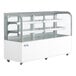 An Avantco white refrigerated bakery display case with curved glass and glass shelves.