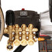 A Simpson Powershot pressure washer with a black and gold finish and a hose.