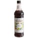 A Monin Premium Wildberry Flavoring Syrup bottle.
