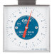 An Edlund mechanical portion scale with a white and blue dial and red hand.