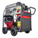 A Simpson Big Brute pressure washer with a red and black Honda engine and wheels.