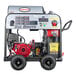 A Simpson 49-state compliant gas powered pressure washer with a red Honda engine and wheels.