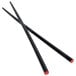 A pair of Town black lacquered wood Japanese style chopsticks with red tips.
