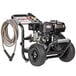 A black and grey Simpson Powershot gas powered pressure washer with a hose.