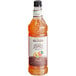 A bottle of Monin Zero Calorie Natural Peach Flavoring Syrup.