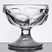 A clear glass Libbey sherbet bowl with a small design on the base.