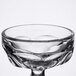 A clear glass bowl with a curved edge.
