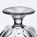 A close-up of a Libbey clear glass sherbet dish with a circular base.