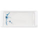 A white rectangular plate with blue and white bamboo design.