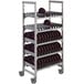A metal Cambro Camshelving® Premium Series rack with plates on it.