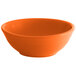 An orange Tuxton Concentrix nappie bowl with a white background.