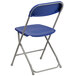 A blue Flash Furniture plastic folding chair with a metal frame and a backrest.