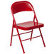 A Flash Furniture red metal folding chair.