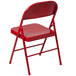 A red Flash Furniture metal folding chair with a backrest.