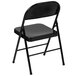 A Flash Furniture black metal folding chair with a black seat and backrest.