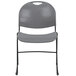 A gray plastic Flash Furniture stack chair with a black frame.
