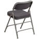 A Flash Furniture gray fabric metal folding chair with a cushion.