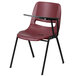 A burgundy plastic Flash Furniture chair with a left handed black tablet arm.