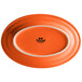 An orange oval Tuxton China platter with a white edge.