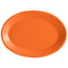 An orange oval Tuxton china platter with a white background.