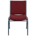 A Flash Furniture Hercules Series burgundy fabric stack chair with a metal frame.