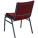 A burgundy patterned fabric Flash Furniture stack chair with metal legs.