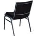 A black chair with a grey back and a metal frame.
