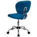 A turquoise office chair with chrome legs and wheels.