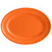 An orange oval Tuxton china platter with a white border.