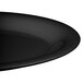 A close-up of a black oval platter.