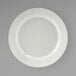 A Tuxton Pacifica bright white china plate with a curved edge.