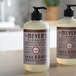 Two bottles of Mrs. Meyer's Clean Day lavender scented liquid hand soap with pumps on a counter.