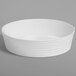 An American Metalcraft Del Mar white plastic serving bowl with wavy lines.