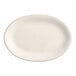 An ivory oval stoneware platter with a white rim.