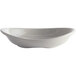 A white Carlisle melamine pasta plate with a curved edge.