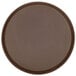 A brown round Cambro Treadlite serving tray with a non-skid brown surface.