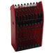 A red plastic berry picker with black plastic combs on the end.