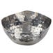 A round silver stainless steel bowl with a hammered texture.