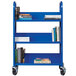 A blue Hirsh Industries book cart with books on it.