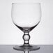A clear Anchor Hocking Schooner Glass with a round base and small rim.