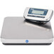 An Edlund digital pizza scale with remote display on a white surface.
