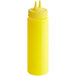 A yellow plastic Vollrath Twin Tip squeeze bottle with a lid.
