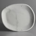 A white marble platter with a black rim.