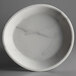 A white Carlisle melamine coupe plate with a marble pattern.
