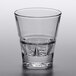 A Libbey stackable rocks glass with a clear liquid inside.