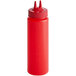 A close-up of a red Vollrath Twin Tip squeeze bottle with a straw top.